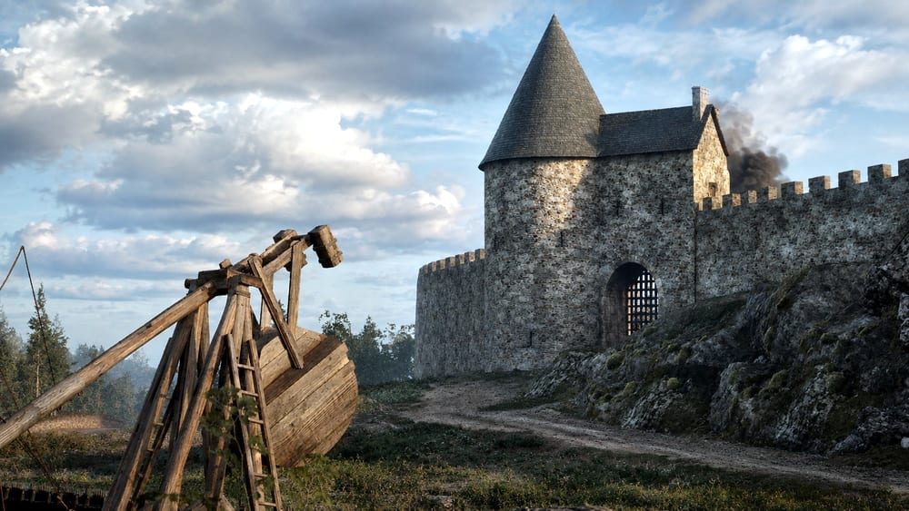 Reconstitution du siège du château de Falaise en 1204 : machines de siège dressées devant le donjon.